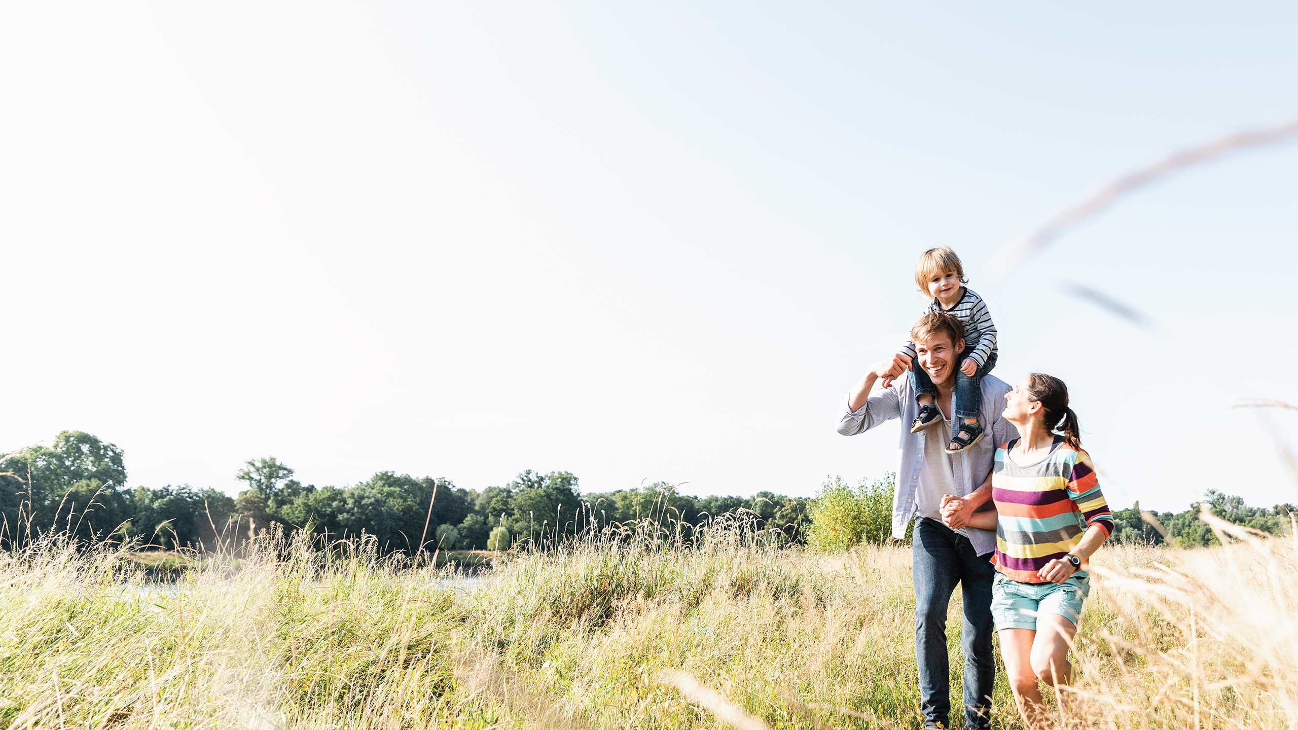 Family walking in a field