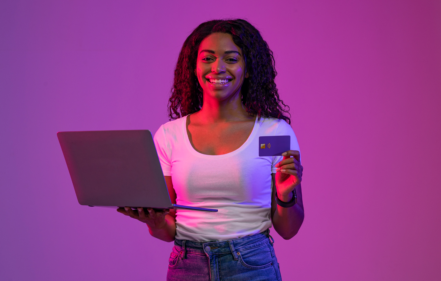 Portrait of cheerful multi ethnic business couple wearing suit and looking at camera with lot of copy space on right side